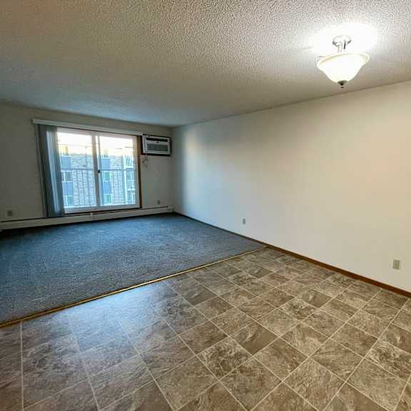 a room with a tiled floor and a window.