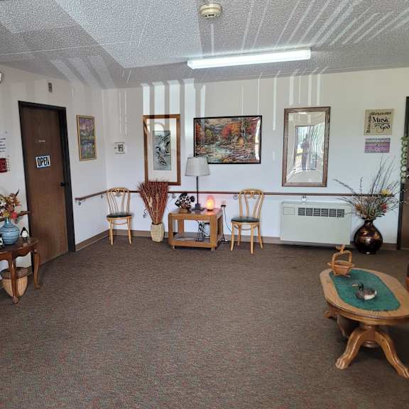 a room with a carpeted floor and a white ceiling with a light fixture.