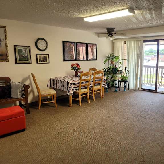 a room with a dining table and chairs.