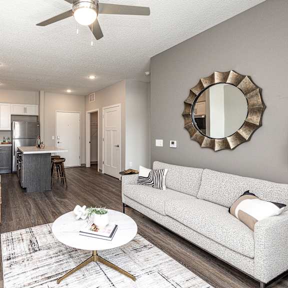 a living room with a couch, chair, and coffee table.