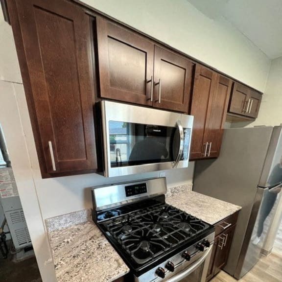 a kitchen with a stove and a microwave