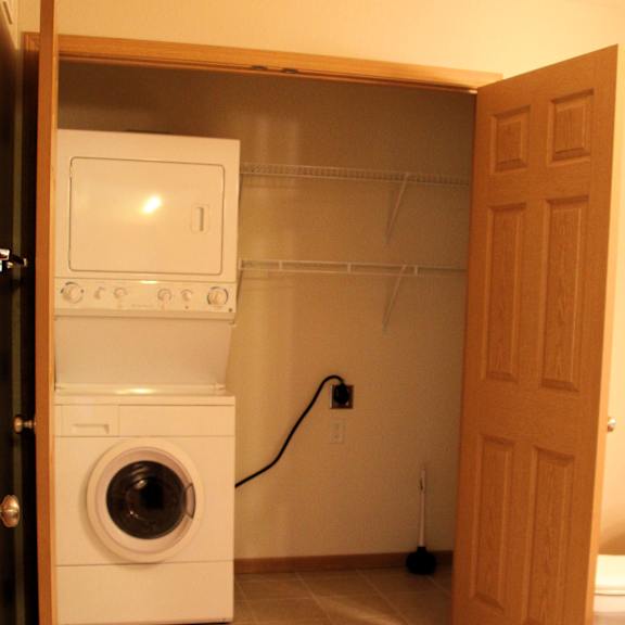 a small laundry room with a washer and dryer.