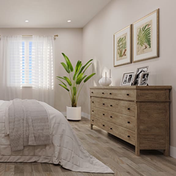 a bedroom with a bed and a dresser and a window