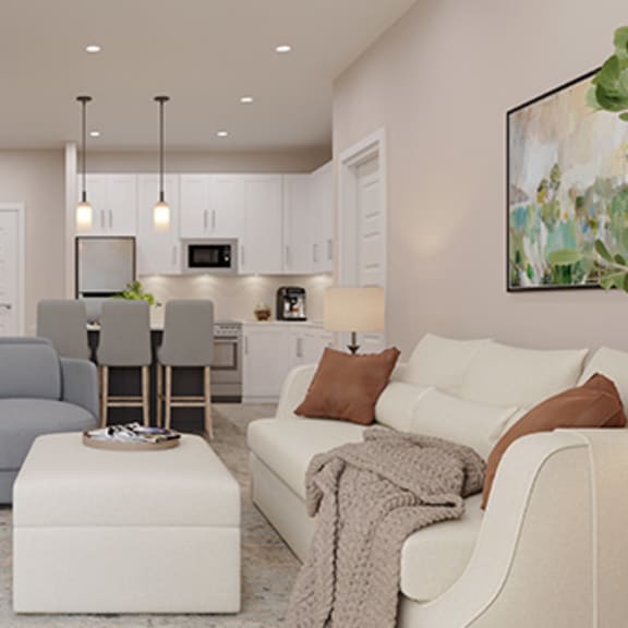a living room with a couch and a chair and a kitchen