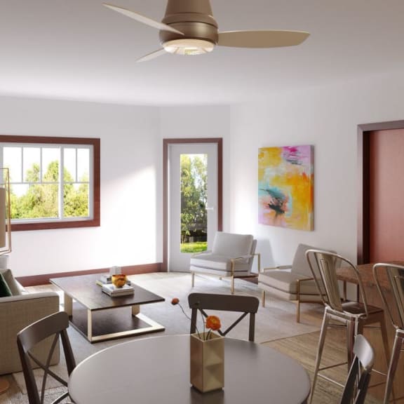 a living room and dining room with a table and chairs