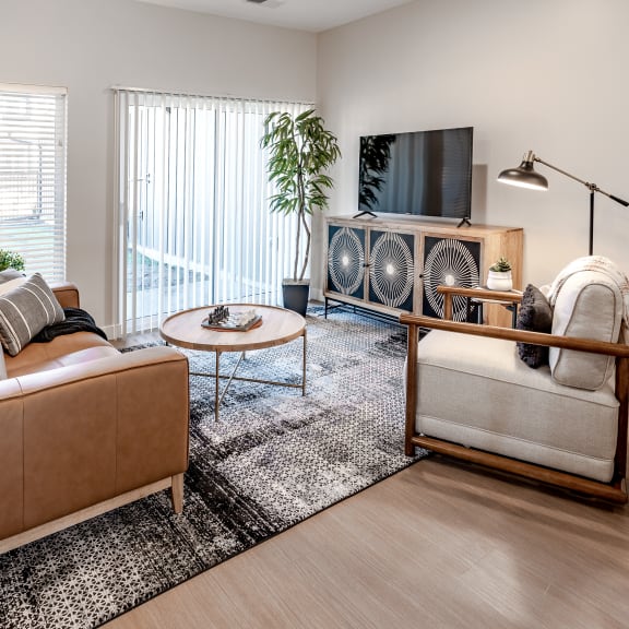 an open living room with a couch and a tv