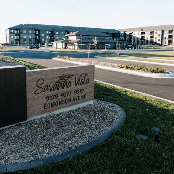 a sign that reads apartments in front of a building