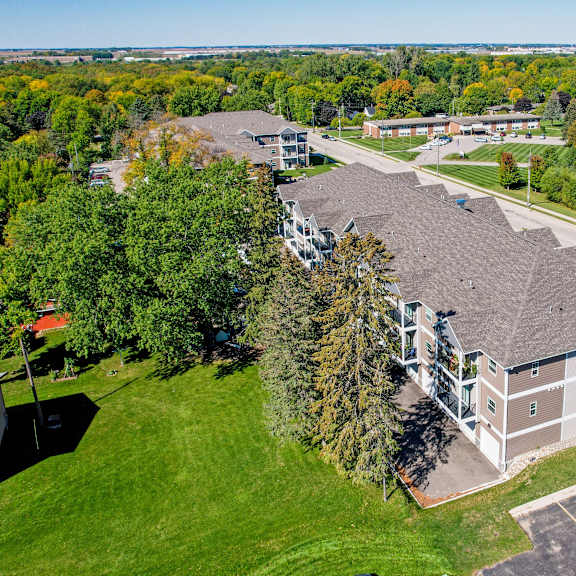a large building with a parking lot in front of it.
