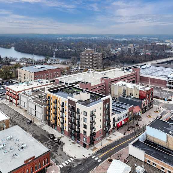 an aerial view of a city with buildings and a river
