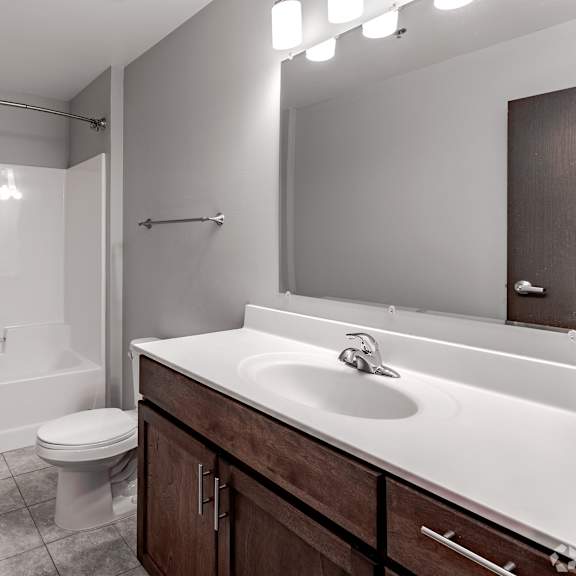 a bathroom with a sink toilet and a shower