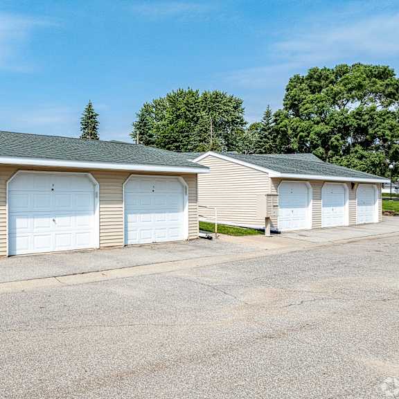 a row of garage doors are closed.