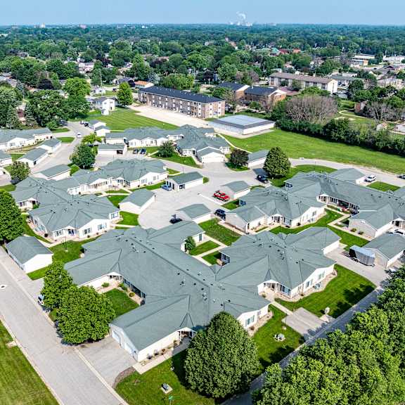 a bird's eye view of a residential area with houses and trees.