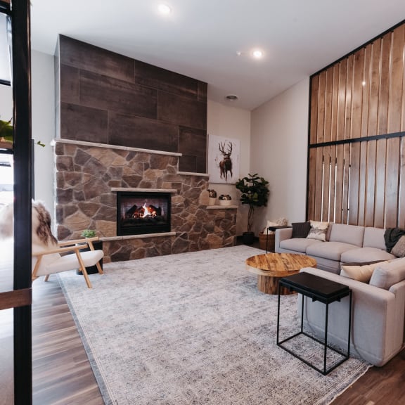 a living room with a couch and a fireplace