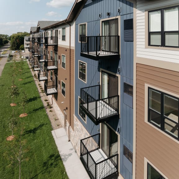 a row of apartment buildings with balconies on the side of them
