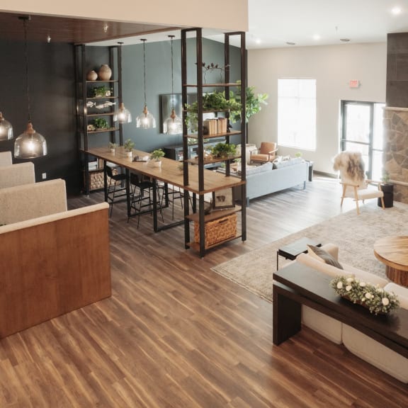 a living room with a fireplace and a dining room