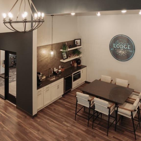 a kitchen and dining room with a table and chairs