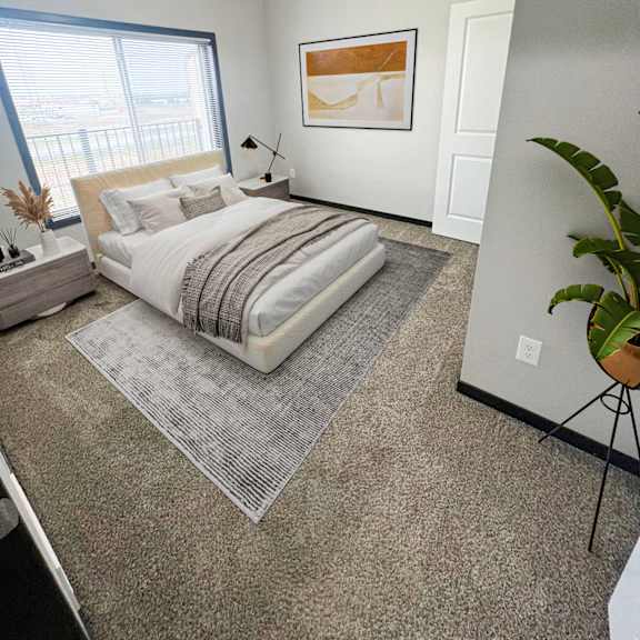 a bedroom with a large bed and a painting on the wall.