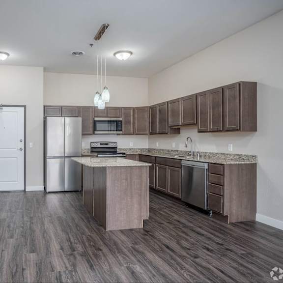 a kitchen with a white door and a counter.