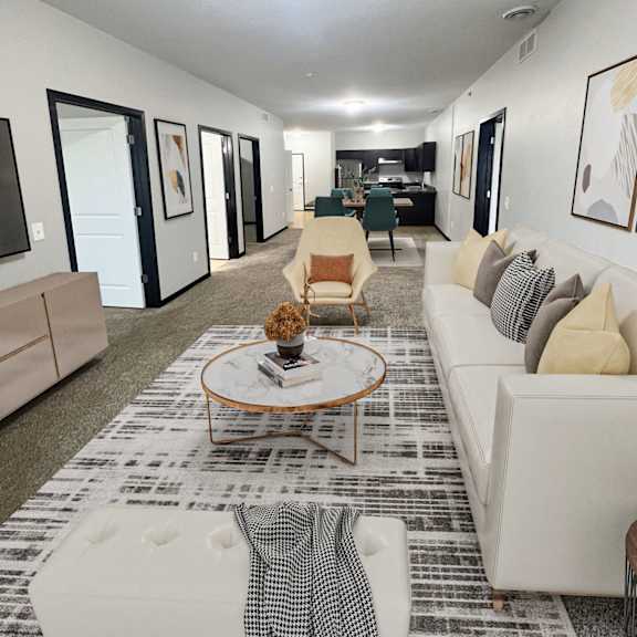 a living room with a white couch and a coffee table.