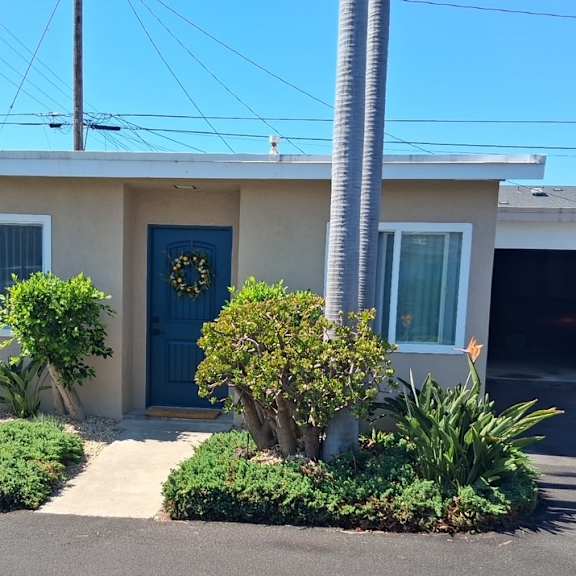 a house with a blue door and a garage.