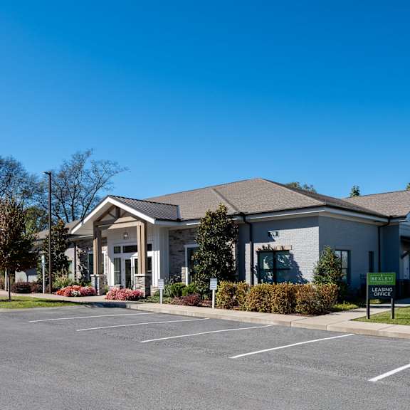 a building with a parking lot in front of it.