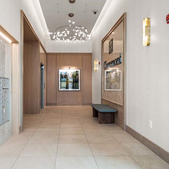 a hallway with a bench and a wall with a sign that says "granite".