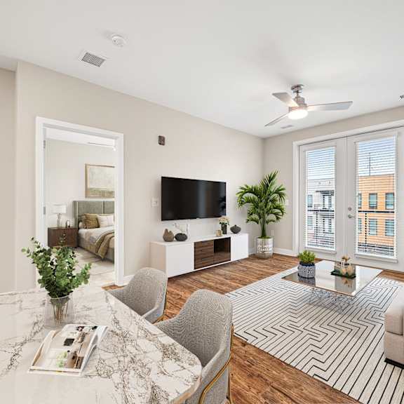 a living room with a white ceiling and a large window.