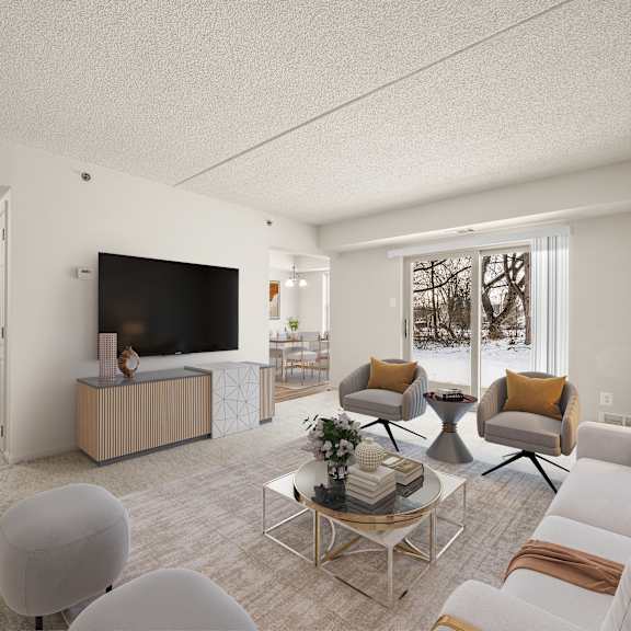 a living room with a television, two chairs, a sofa, and a coffee table.
