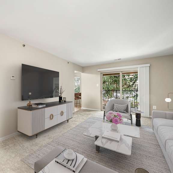 a modern living room with a television, sofas, and a coffee table.