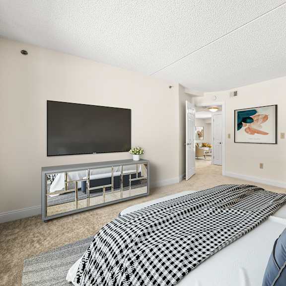 a bedroom with a large bed and a television.