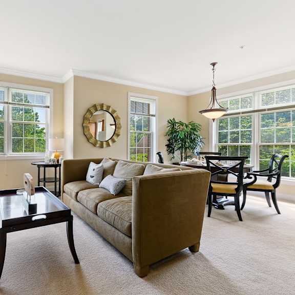 bright, sunlit living area with plenty of natural light, creating a warm and inviting atmosphere at claremont apartments in exton, pa