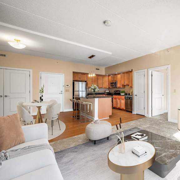 a living room with a white couch and a coffee table.