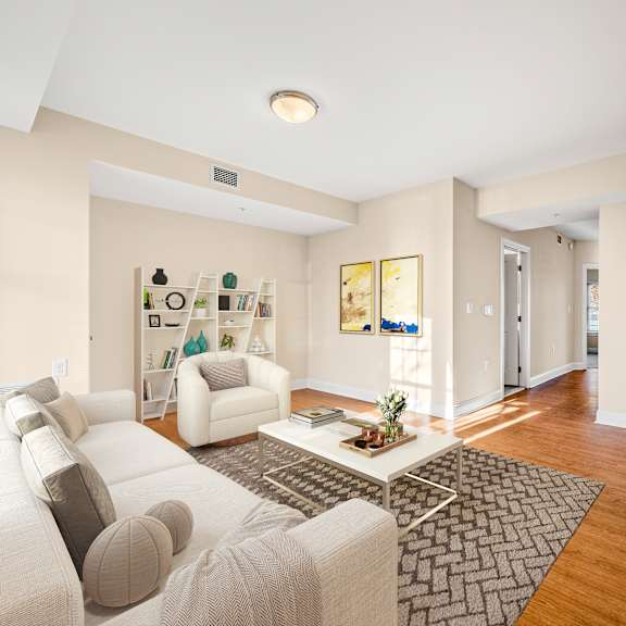 a living room with a white couch and a coffee table.