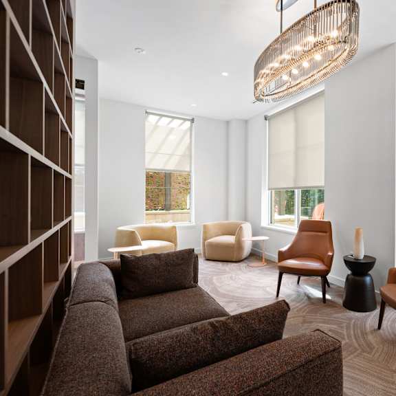 inviting living room with a cozy couch, comfortable chairs, and large window offering natural light at hamilton at eagleview, exton, pa