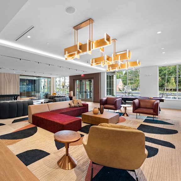 elegant lobby at hamilton at eagleview featuring comfortable seating and stunning light fixtures, exton, pa 19341