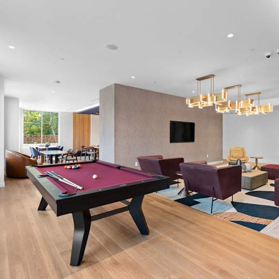 spacious living room featuring a pool table and comfortable couches at hamilton at eagleview, exton, pa 19341