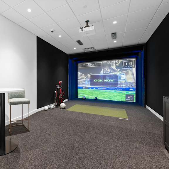 sleek multi-sport simulator room at hamilton at eagleview, offering a fun and interactive experience in exton, pa