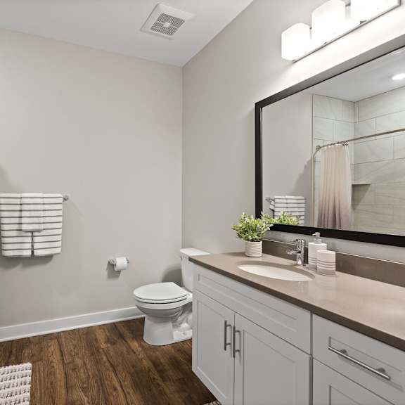 modern bathroom featuring a large mirror, a shower, and a toilet at hamilton at eagleview, exton, pa 19341