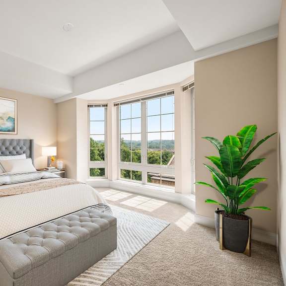 a bedroom with a large bed and a painting on the wall.