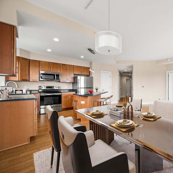 a modern kitchen with a dining table and chairs.