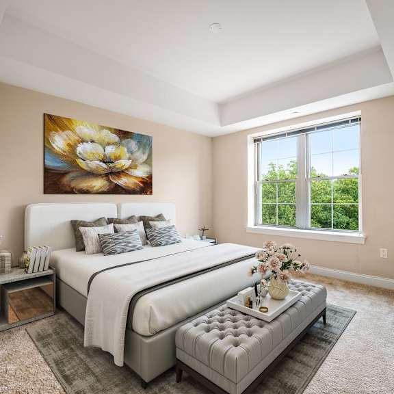 a bedroom with two beds and a painting on the wall.