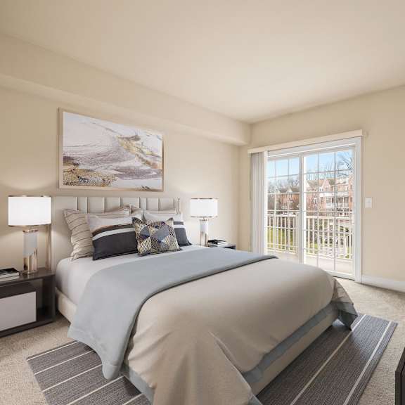 cozy bedroom featuring a large bed and a framed painting on the wall at claremont apartments in exton, pa