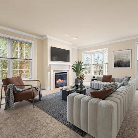 cozy living room with a fireplace and a comfortable couch at claremont apartments in exton, pa