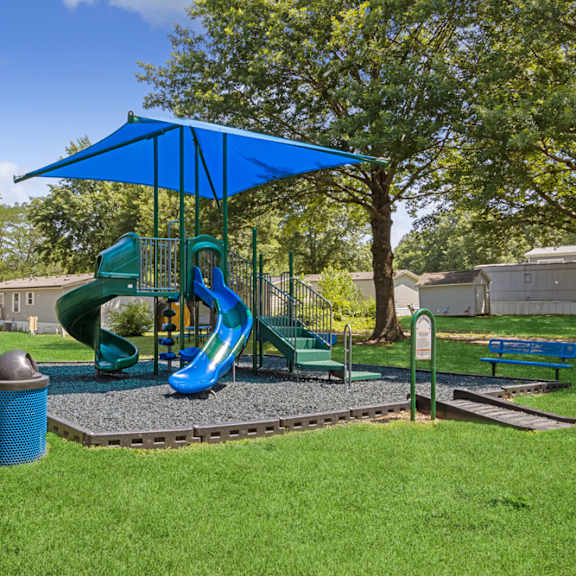 playground with sun cover at southfork mhc in belton, mo