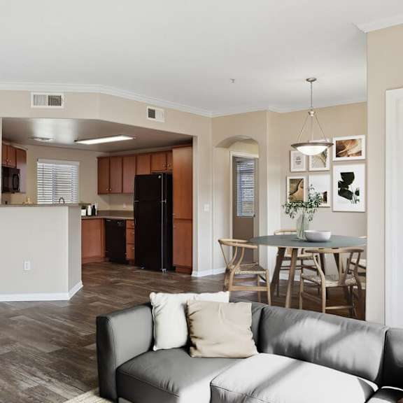 model living room with view of kitchen at reserve at rancho apartments