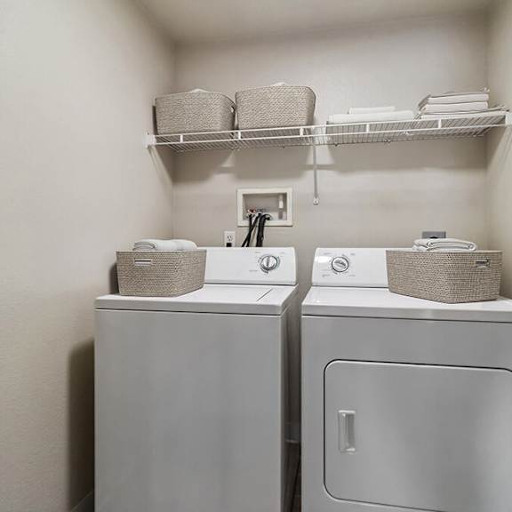 model laundry room with washer & dryer at reserve at rancho apartments located in moreno valley, ca.