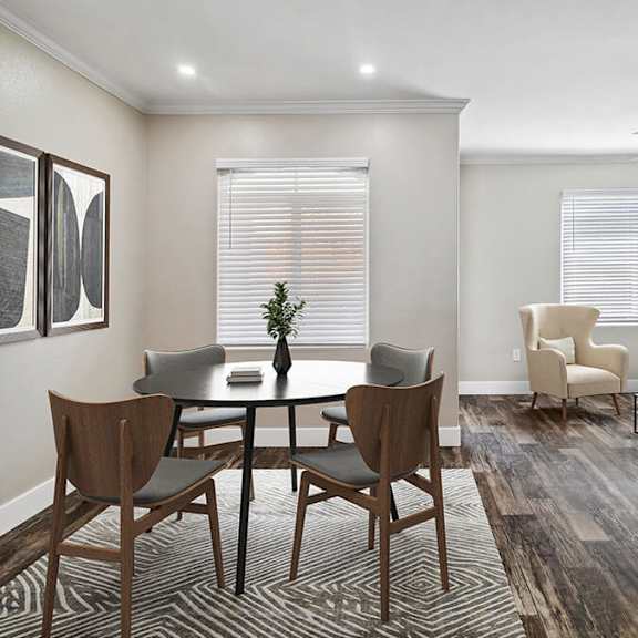 model dining/living room with wood-style flooring at reserve at rancho apartments located in moreno valley, ca.