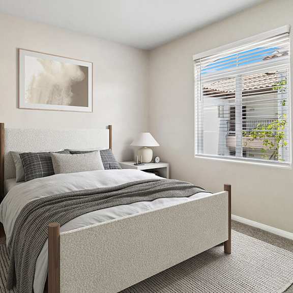 model bedroom with carpet and window view at reserve at rancho apartments located in moreno valley, ca.