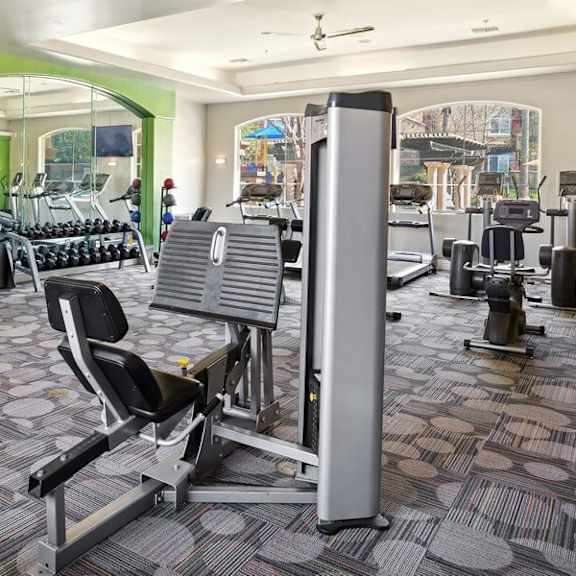 community fitness center with equipment at reserve at rancho apartments
