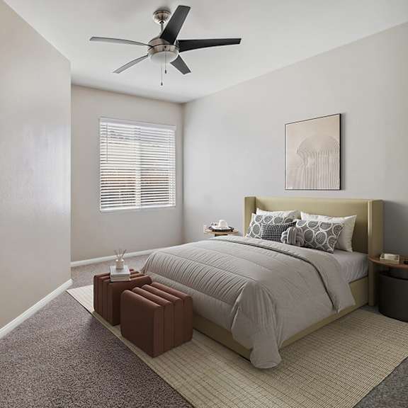 model bedroom with carpet and window view at reserve at rancho apartments located in moreno valley, ca.